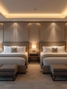 a hotel room with two beds and two tables at Coco Villa Payagala in Paiyagala South