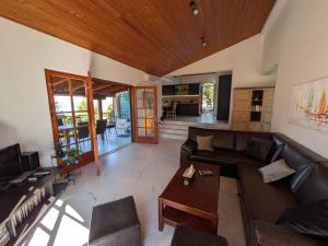 a living room with a couch and a table at Villa Punta in Maslinica