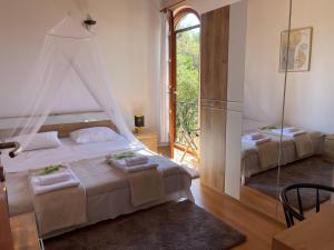 a bedroom with two beds and a window at Villa Punta in Maslinica +55 photos