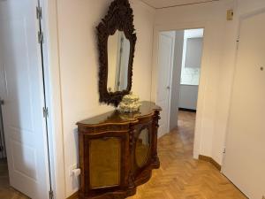 a room with a mirror on the wall and a table at Ti Miquel in Ifach +20 photos