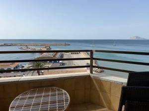 a balcony with a view of the beach and the ocean at Ti Miquel in Ifach