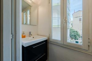 a bathroom with a sink and a window at Sole Mio in Sanremo +40 photos