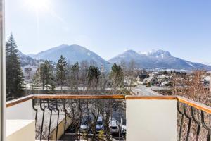 a view from a balcony with mountains in the background at Hotel Vauban Briançon Serre Chevalier in Briançon