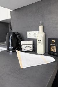 a bottle of soap sitting on top of a kitchen counter at Black & Yellow Studio in Augsburg