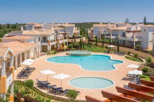 an image of a swimming pool in a resort at NAU Salema Beach Village in Salema