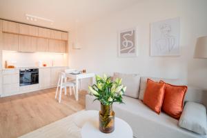 a living room with a couch and a table at Prime Apartments Gdańsk in Gdańsk