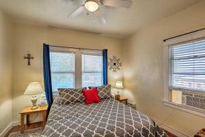 a bedroom with a bed and two windows at Walkable Group Getaway in Bisbee: 4-Unit Bundle! in Bisbee