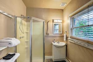 a bathroom with a shower and a sink at Walkable Group Getaway in Bisbee: 4-Unit Bundle! in Bisbee +36 photos