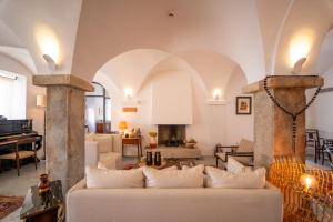 a living room with a couch and a table at Casa Amor Olhão in Olhão