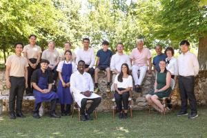 a large group of people posing for a picture at La Chartreuse du Bignac - Teritoria in Saint-Nexans