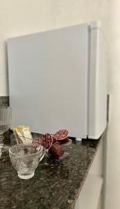 a counter with two bowls of chocolate on it at Casa Freitas - suíte 1 in Extrema