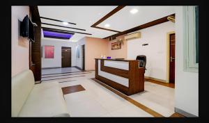 a living room with a desk and a hallway at Hotel Starwood Near Airport Road Sector 78 Mohali Chandigarh in Mohali +22 photos