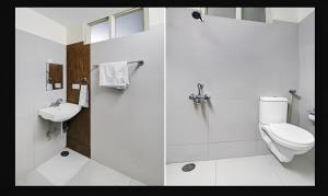 a bathroom with a shower and a toilet and a sink at Hotel Starwood Near Airport Road Sector 78 Mohali Chandigarh in Mohali