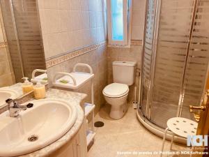 a bathroom with a sink and a toilet and a shower at San Gregorio 2 in Soria