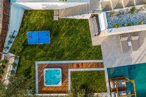an overhead view of a yard with a pool at Aurora Thesan in Marathias