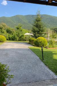 a driveway with a parking meter in the grass at Guesthouse Anestis in Angistron