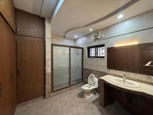 a bathroom with a toilet and a sink at Arizona 2 in Islamabad +63 photos