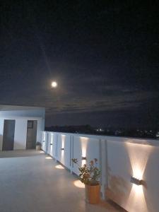 a view of a balcony at night with a moon at Hôtel Belvédère in Toliara