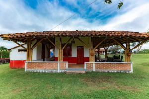 a small house with a red at El cantor Finca hotel in Quimbaya