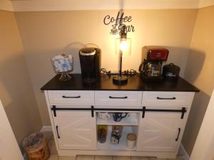 a kitchen counter with a coffee shop on it at Courtside Condo at Summit in Bellaire