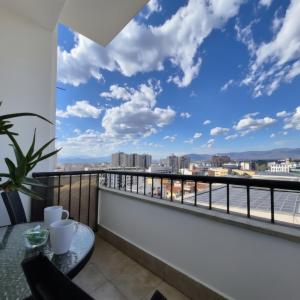 a balcony with a view of the city at Above the City, walk everywhere - 2BR, 2 Baths in Skopje