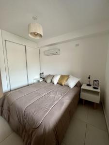 a bedroom with a large bed in a room at KIRA HAUS, North Green in Villa Allende +9 photos