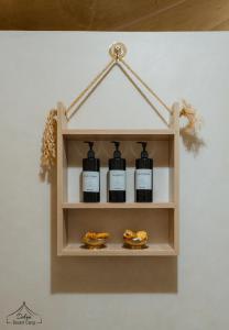 a shelf with four bottles of food on it at Dihya Luxury Camp in Merzouga