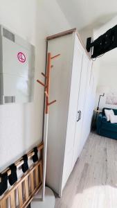 a room with a closet with a door in it at Cabourg-Angle bleu in Cabourg +14 photos