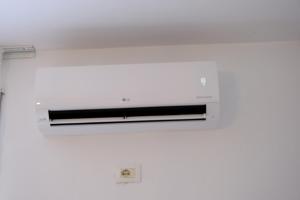 a white ceiling with a light on it at Sea View Family Apartment Durres in Durrës