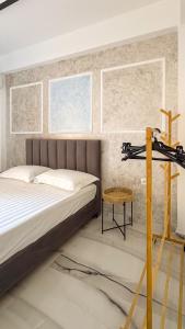 a bedroom with a bed and a table at Thea Rooms in Himare +77 photos