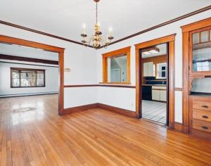 a large room with a wooden floor and a kitchen at spacious room with great amenities in Boston