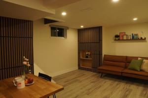 a living room with a couch and a table at ION House - Near Shopping Kennedy Station Easy Transit Downtown in Toronto