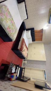 a dorm room with two bunk beds and a bed at Hotel Sereena residence in Multan