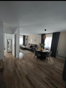 a living room with a table and a couch at Sitges Casablanca in Sant Pere de Ribes