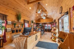 a large room with wooden walls and wooden floors at Presidential Mountain Resort in Bethlehem