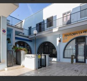 a blue and white building with a balcony at Otranto City Center - Steps from the Beach in Otranto