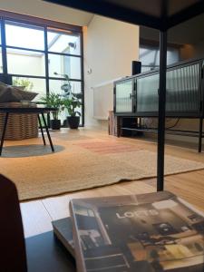a living room with a couch and a table at Sol 41 in Bragança