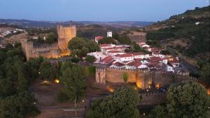 an aerial view of a town with a castle at Sol 41 in Bragança