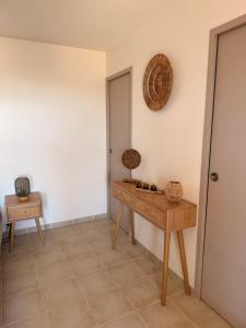 a room with a wooden table and a mirror at Casa Punta Di Vista in Venaco +11 photos