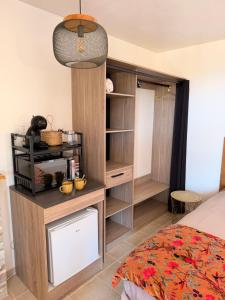 a bedroom with a bed and a book shelf at Casa Punta Di Vista in Venaco