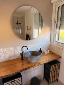 a bathroom with a sink and a mirror at Casa Punta Di Vista in Venaco