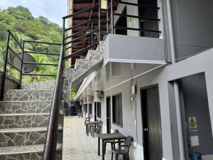 a stairway with chairs and tables on a building at Los Cabos in Bahía Solano