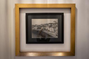 a picture in a frame on a wall at Espaço Calheta in Ponta Delgada +48 photos