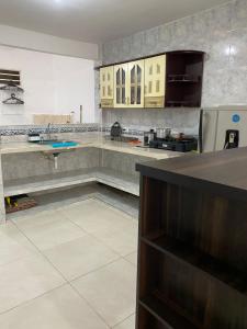 a kitchen with a counter in the middle of it at Apto Albor Blanco in Popayan