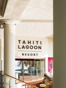 a sign for a hair room in a building at Tahiti Lagoon Resort in Punaauia