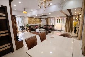 a living room with a white table and chairs at Shri krishna paradise in Panvel