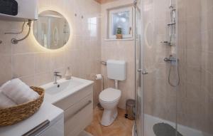 a bathroom with a toilet and a shower and a sink at Villa Fiore di san Antonio in Rovinj +14 photos