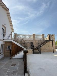 a staircase on the side of a building at La casuca de Candela in Santillana del Mar