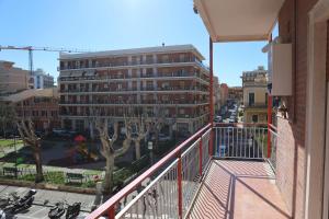 an apartment balcony with a view of a street at B&B Le Eolie in Milazzo