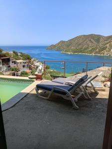 avisorvisor shot of a lounge chair on a balcony with the ocean at Buena Vista in Taganga